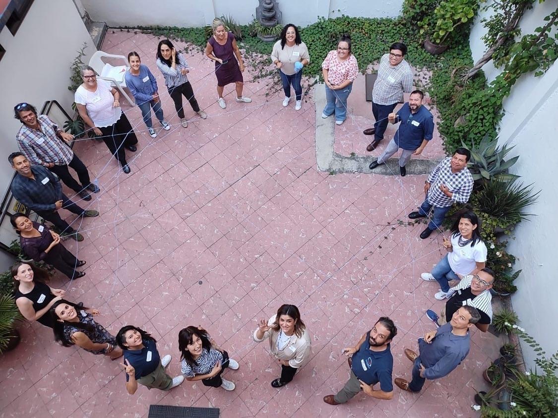 group of people standing in a circle outside